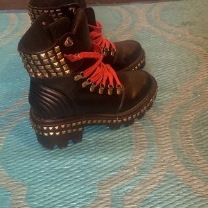 Studded black boots with red lace
